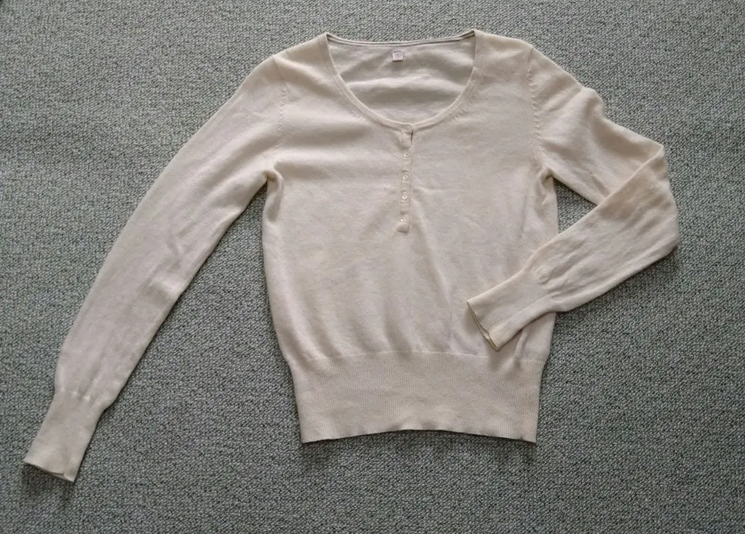 Thumbnail of Cream-colored long-sleeved knit sweater with buttons, Uniqlo, wool, size S, women's