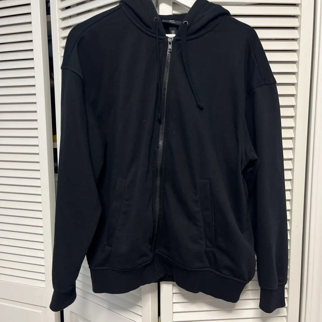 Thumbnail of Black hooded zip-up parka