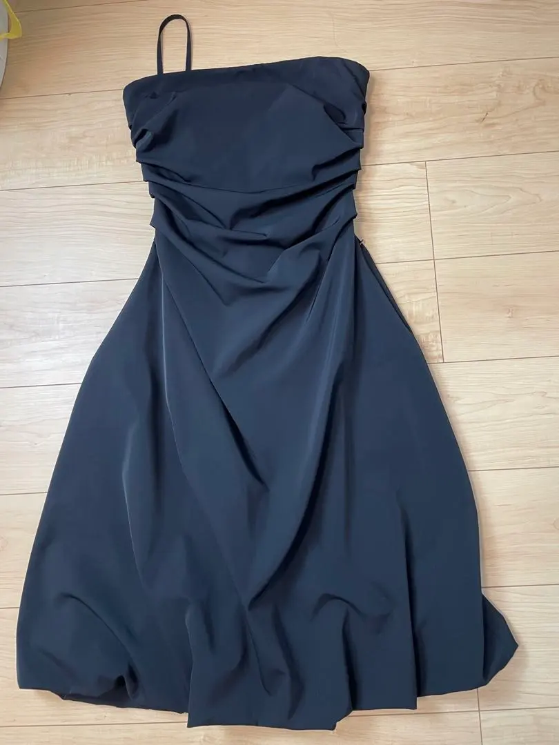 Thumbnail of Black dress with straps, size 40