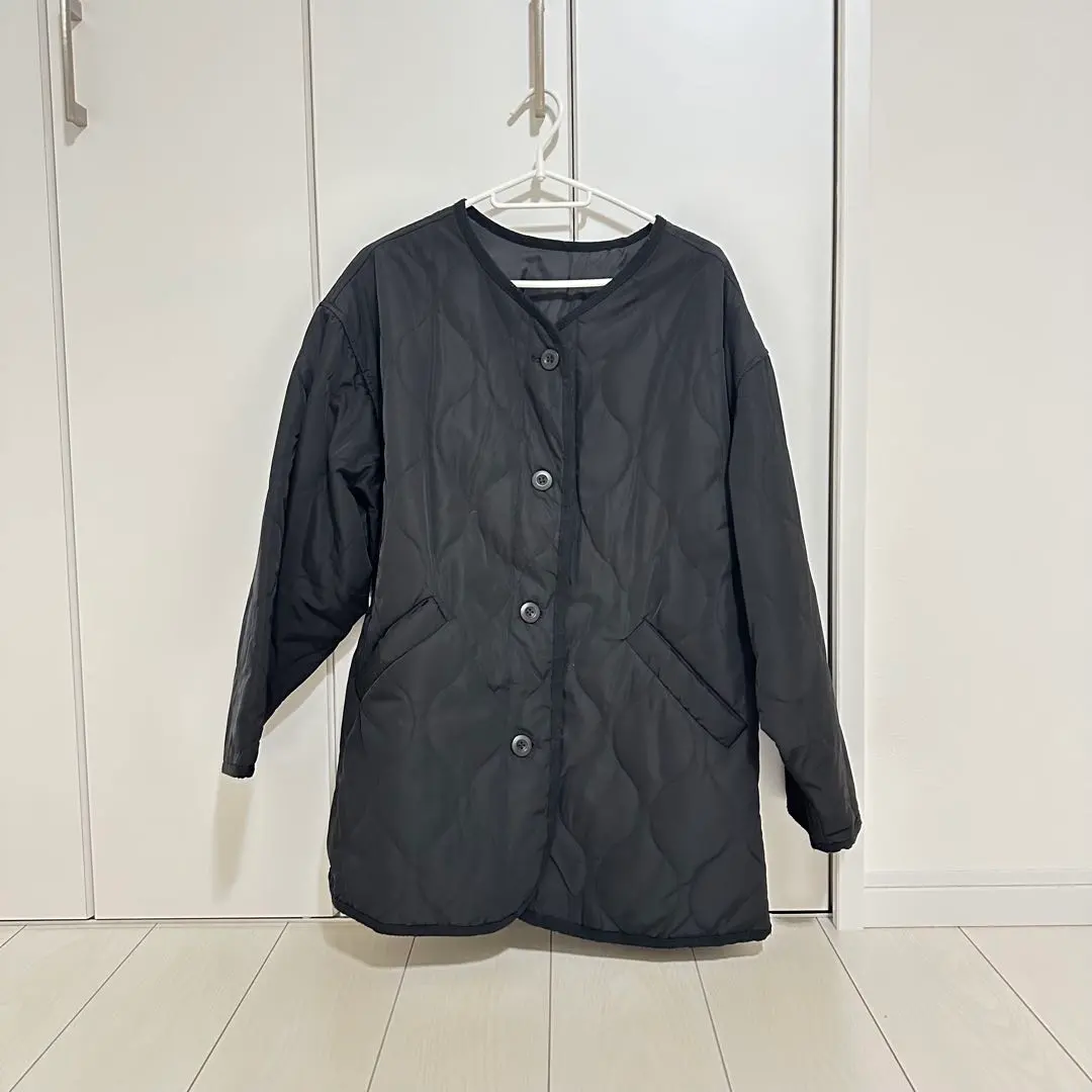 Thumbnail of Black quilted jacket