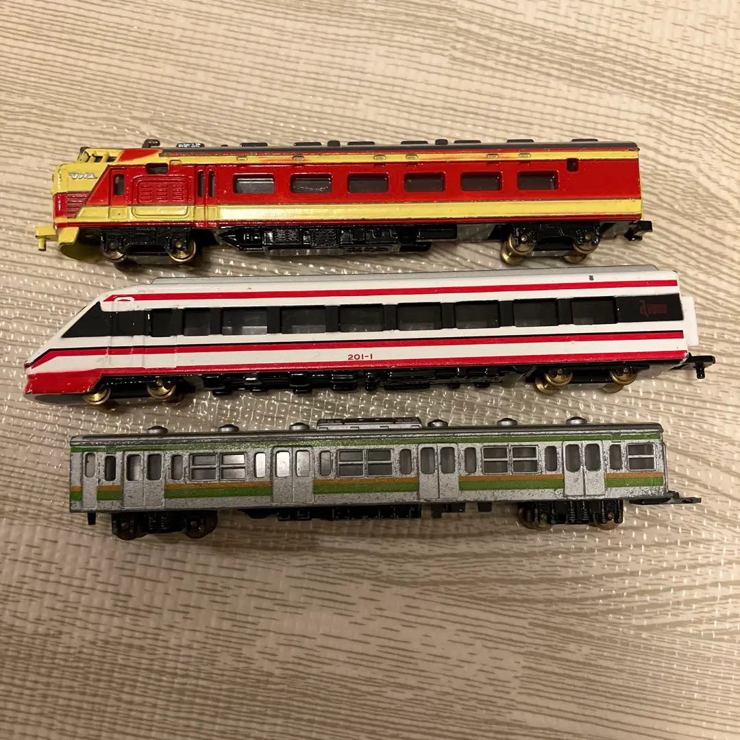 Thumbnail of Model train set: Red/White diesel locomotive, Shinkansen bullet train, passenger cars