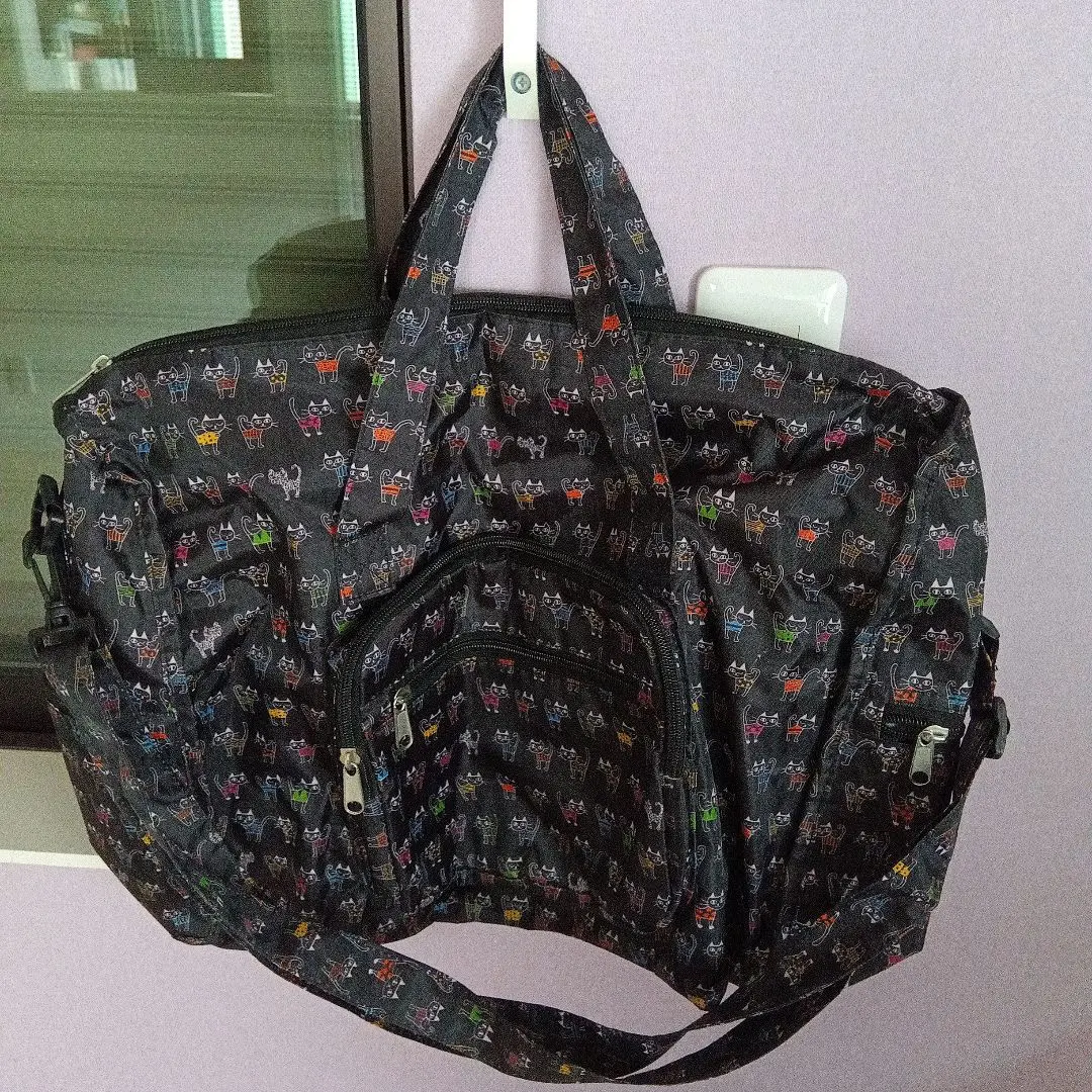 Thumbnail of Two-way (shoulder, tote) bag featuring many cats, folds to B5 size.