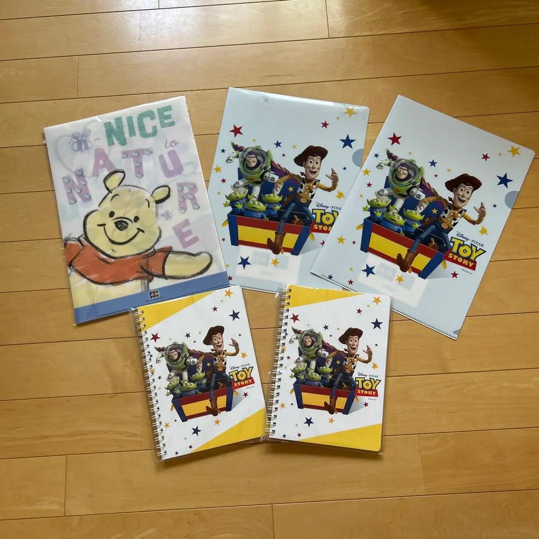 Thumbnail of Three Disney clear files and two notebooks.