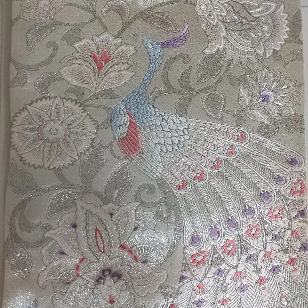 Thumbnail of Fukuro obi (double-layered obi) with platinum foil, 900-mon weave brocade, featuring a peacock design. Silver background with purple, pink, white, and light blue colors. Six-panel pattern.