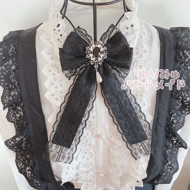 Thumbnail of Mass-produced ribbon brooch with crystal, bijou, and lace