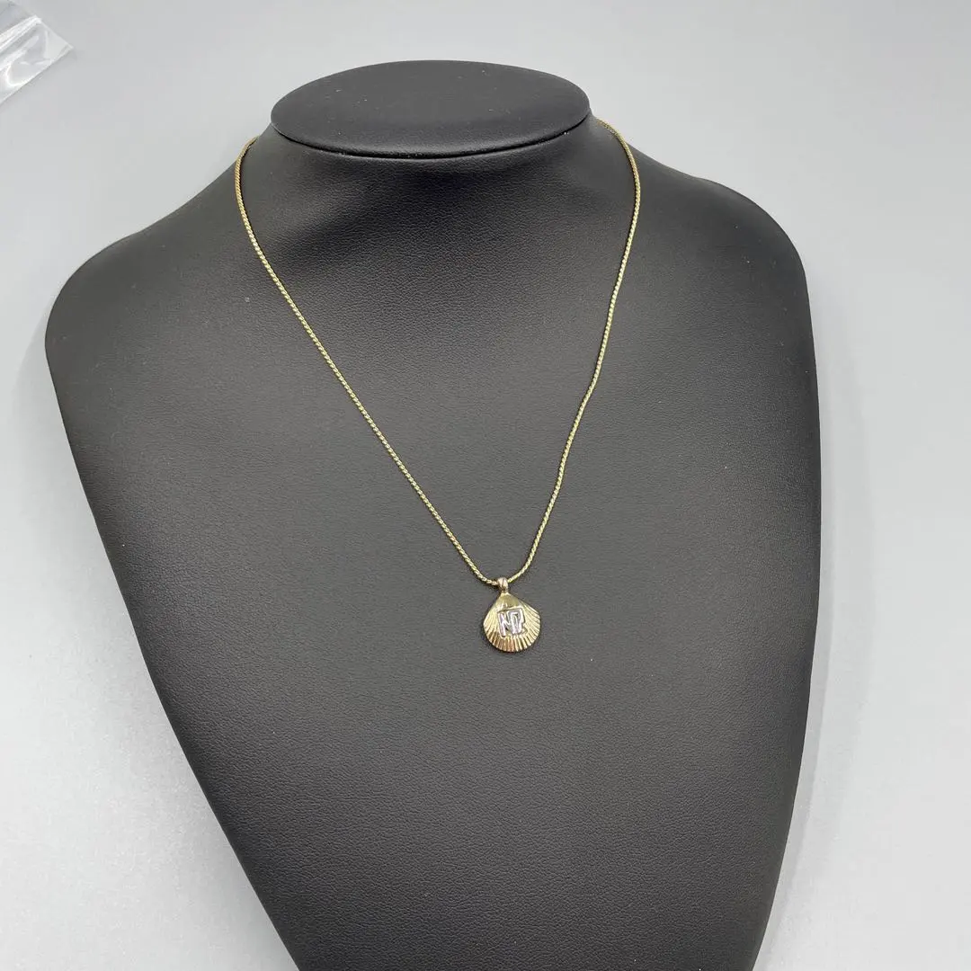 Thumbnail of 048 Nina Ricci Engraved Shell-Shaped Necklace