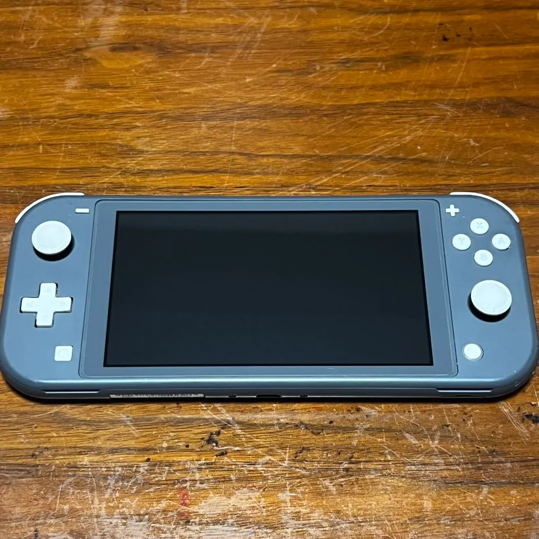 Thumbnail of Nintendo Switch Lite console with faulty charging port, junk item