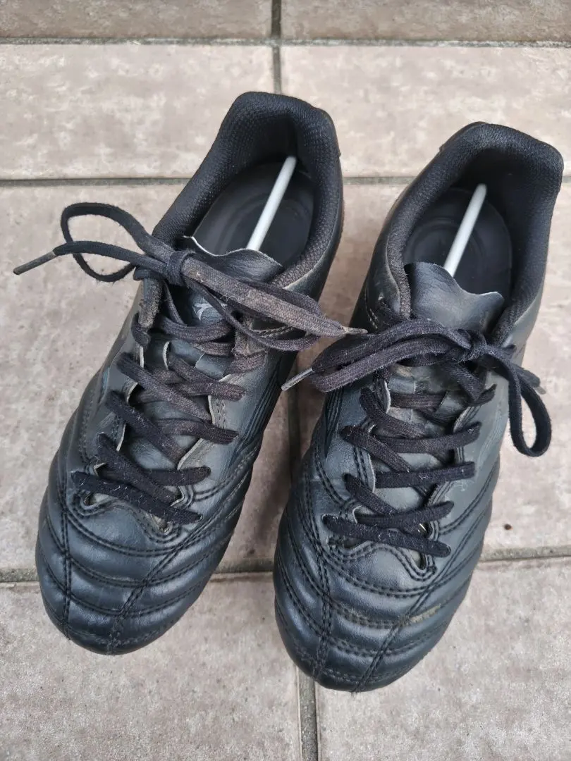 Thumbnail of Black leather soccer shoes, mid-cut