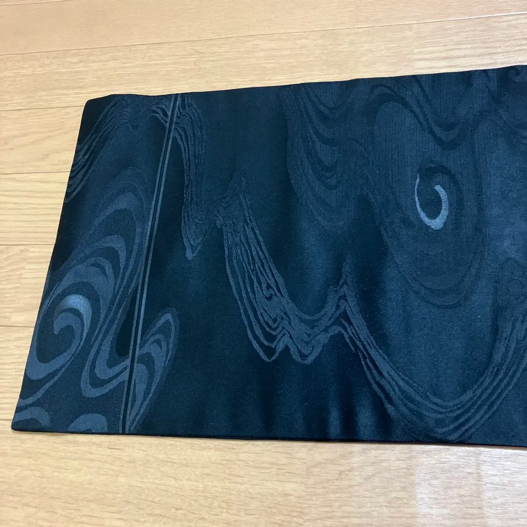Thumbnail of Black swirling pattern obi, mourning obi