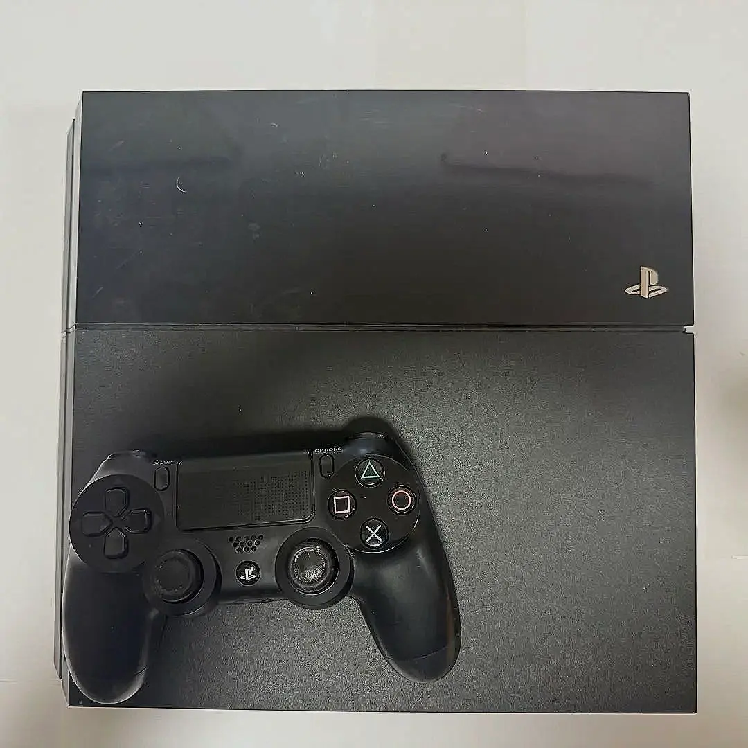 Thumbnail of PlayStation 4 console, black, with controller