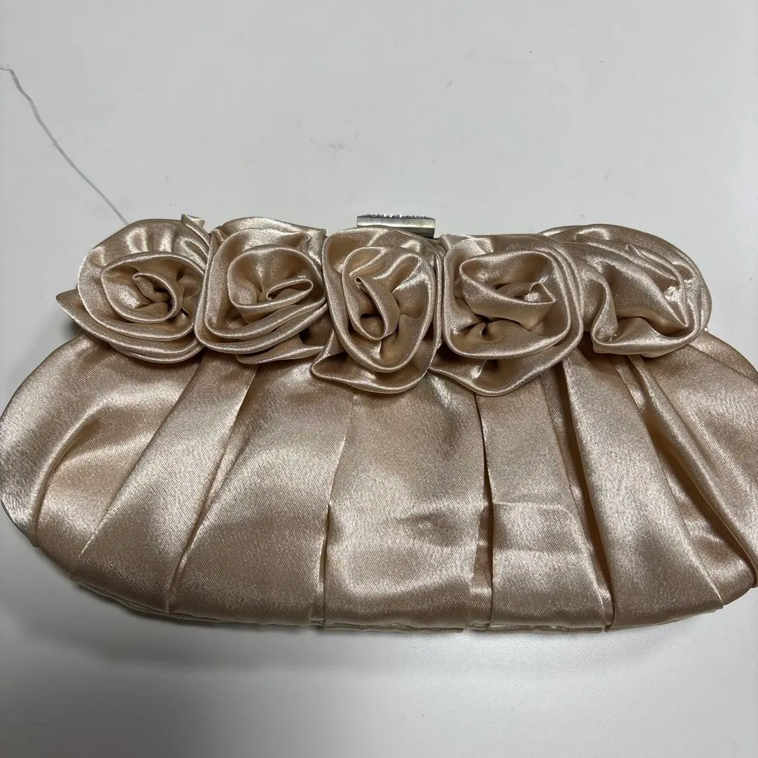 Thumbnail of Beige satin clutch bag