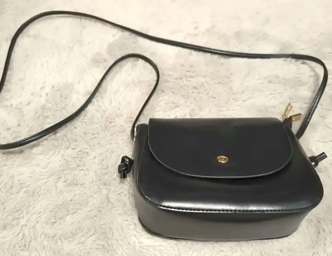 Thumbnail of Excellent condition black leather shoulder bag, purse