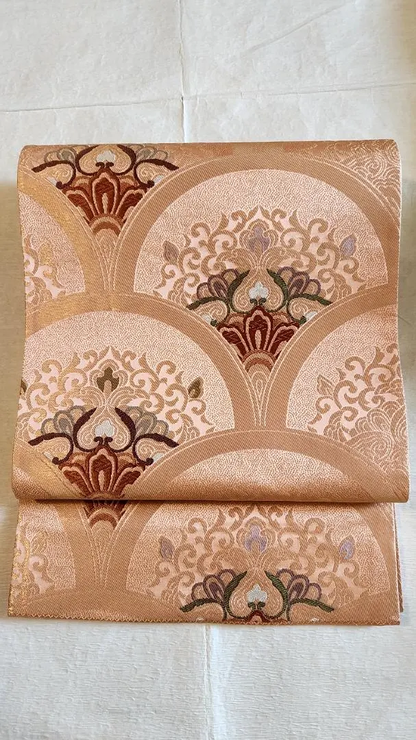 Thumbnail of Fukuro obi (formal obi) in orange with embroidered floral patterns such as seigaiha (wave) and karakusa (arabesque)