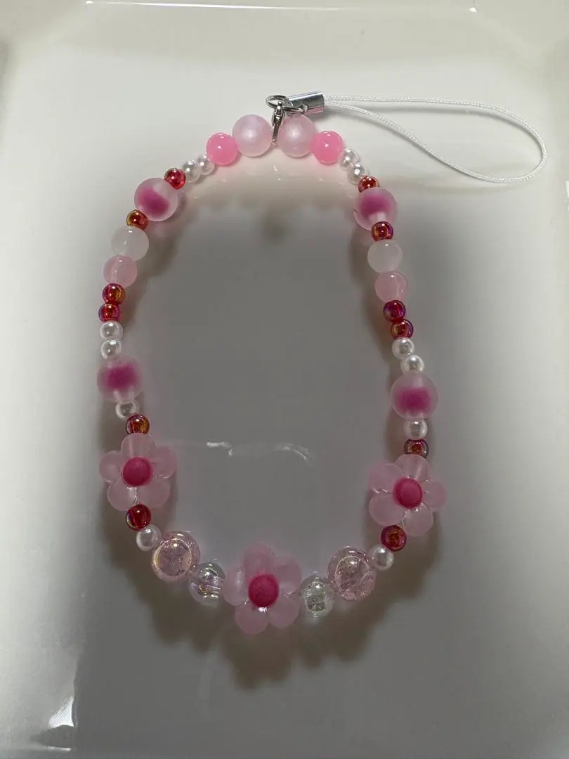 Thumbnail of Pink flower motif cell phone strap