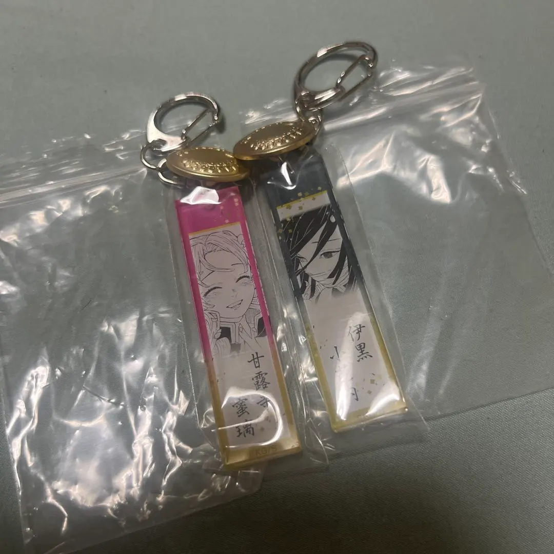 Thumbnail of Demon Slayer Corps Uniform Button Acrylic Charms - Obanai Iguro & Mitsuri Kanroji (Pair)