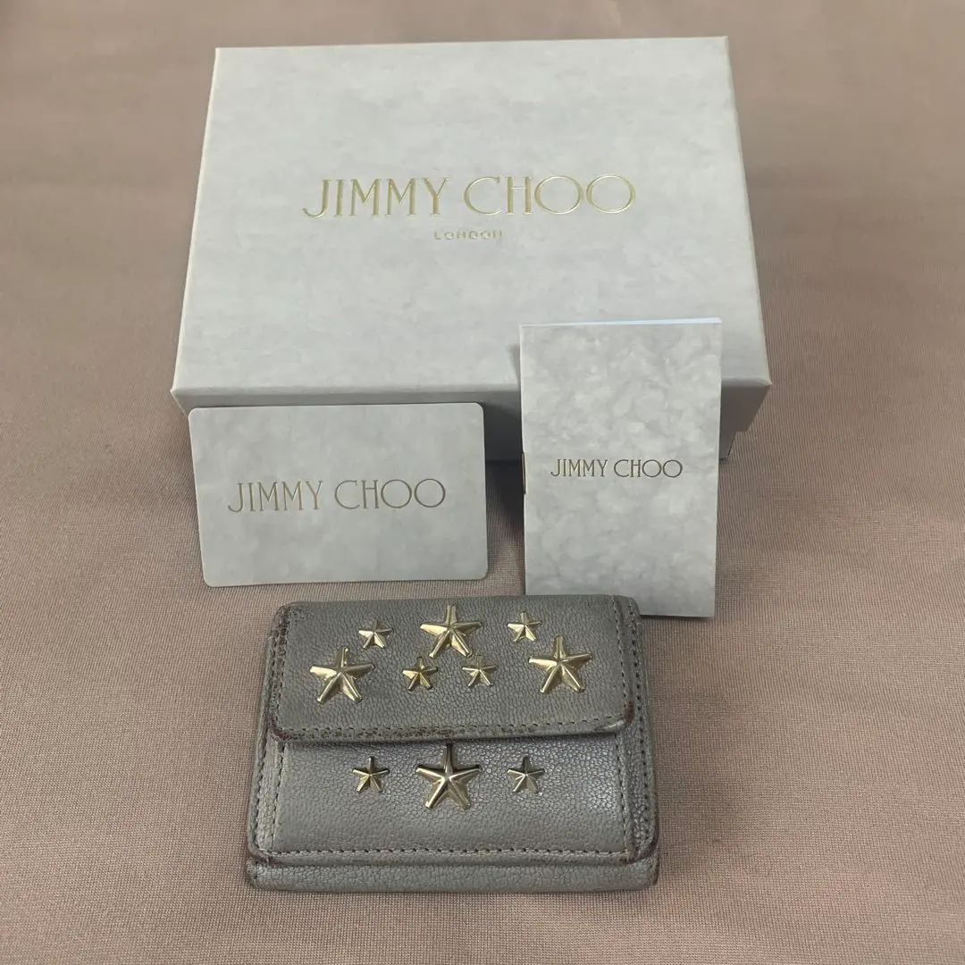 Thumbnail of Final price reduction: JIMMY CHOO star-shaped stud trifold wallet