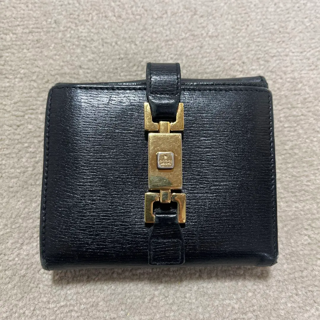 Gucci Jackie 黑色皮革對摺錢包 金色金屬配件 古董 的縮圖