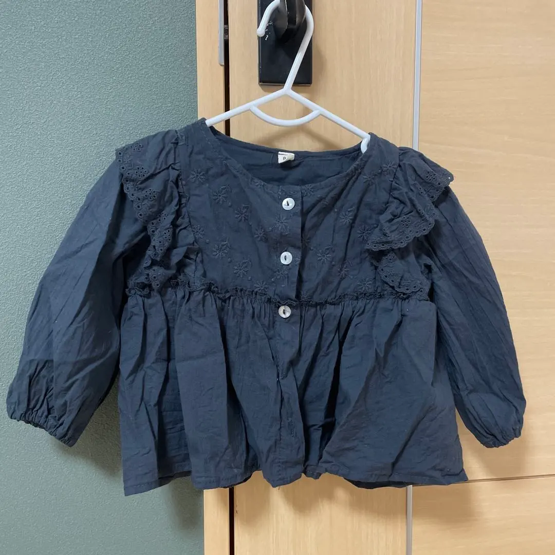 Thumbnail of Black long-sleeved shirt with frills