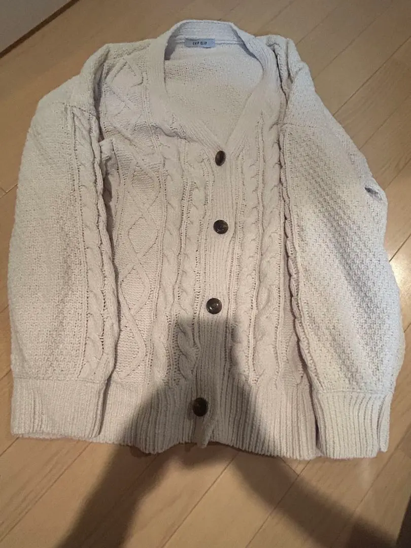 Thumbnail of Ivory cable knit cardigan