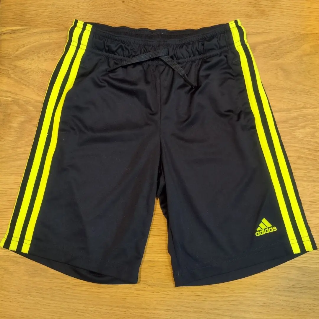 Thumbnail of Adidas half pants, black and yellow, size 140, training jersey