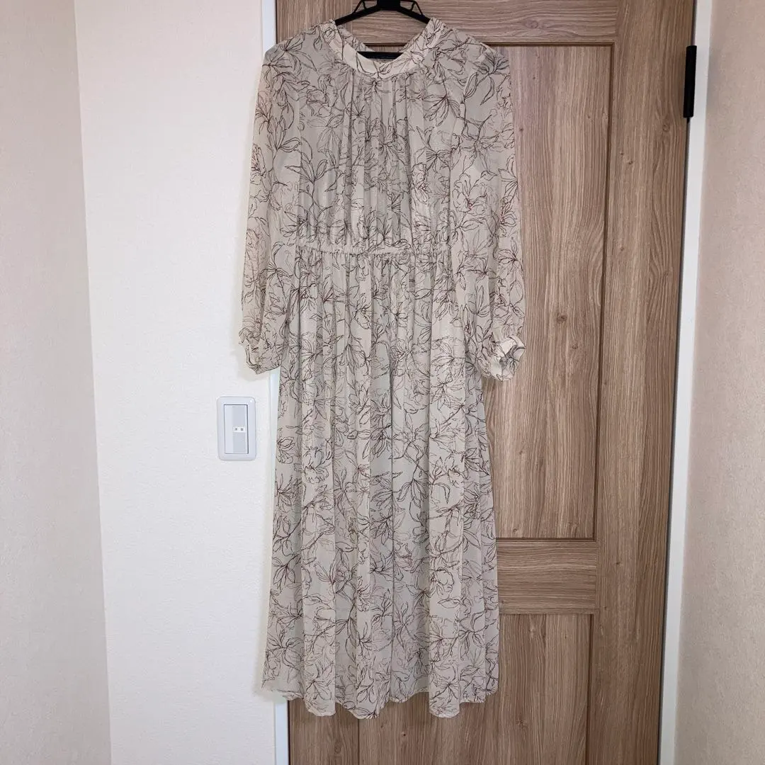 Thumbnail of Floral beige long-sleeved long dress