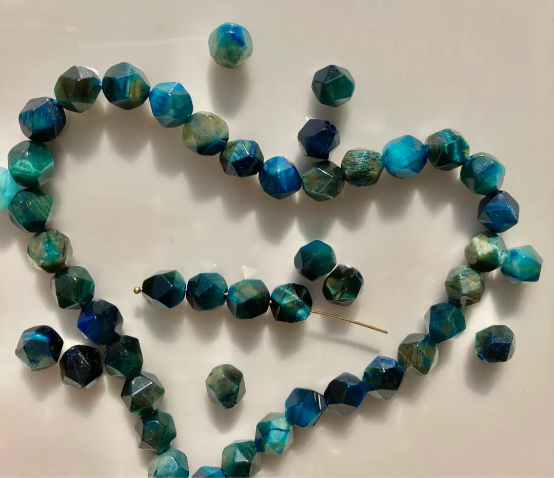 Thumbnail of One strand, blue-green tiger's eye, multi-faceted cut, 8mm, approximately 45 pieces