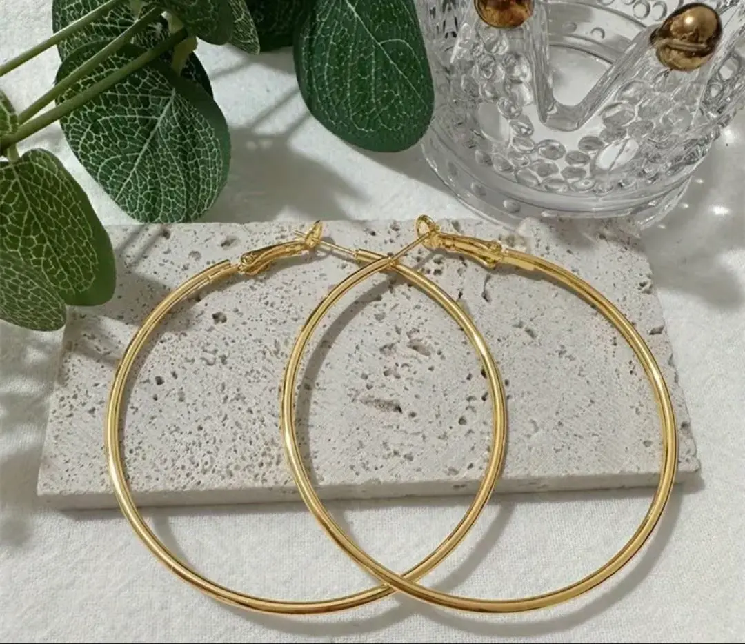 Thumbnail of Gold hoop earrings, large, ⑨