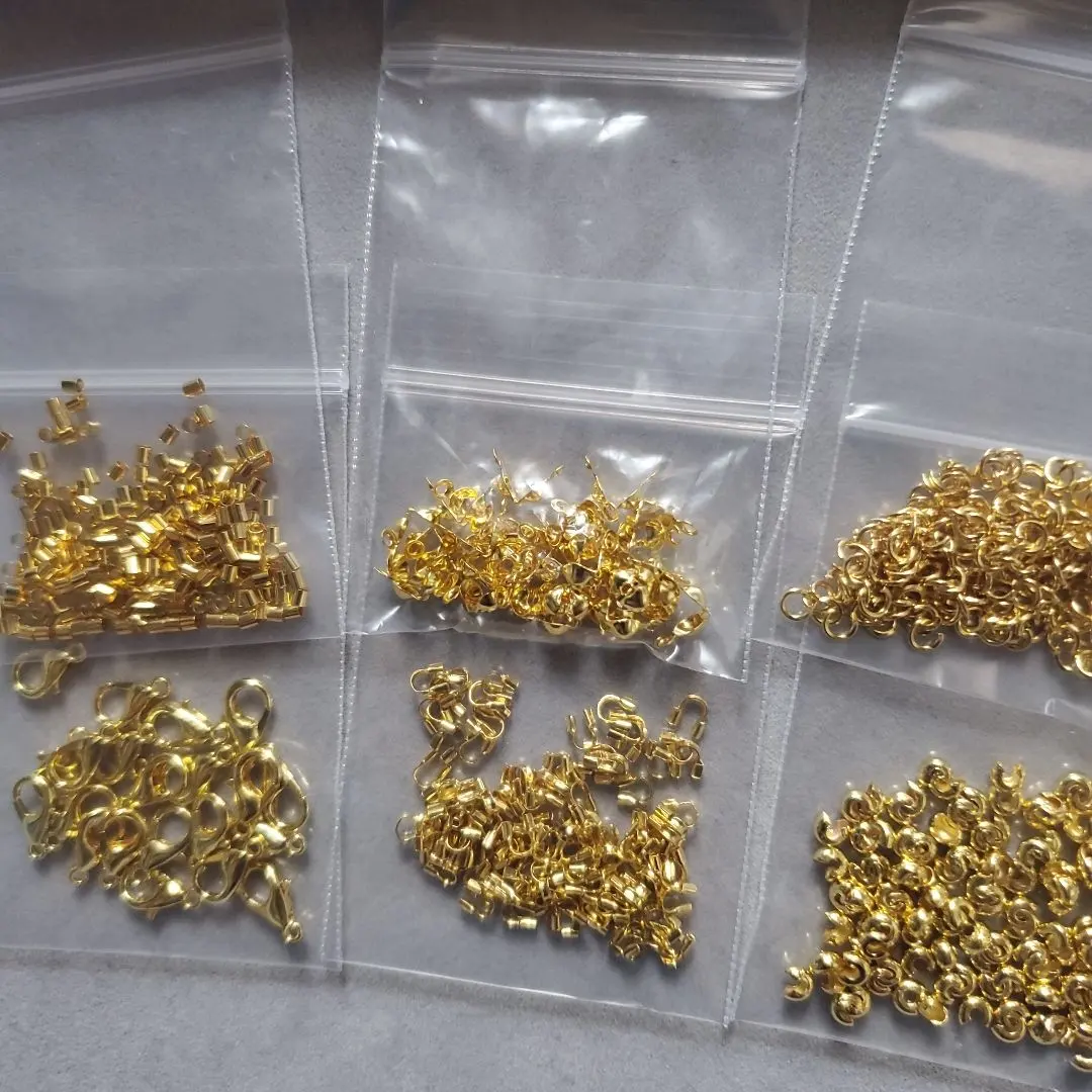 Thumbnail of Bulk sale: U-shaped metal fittings, crimp beads, covers, lobster clasps, split rings, ball tips