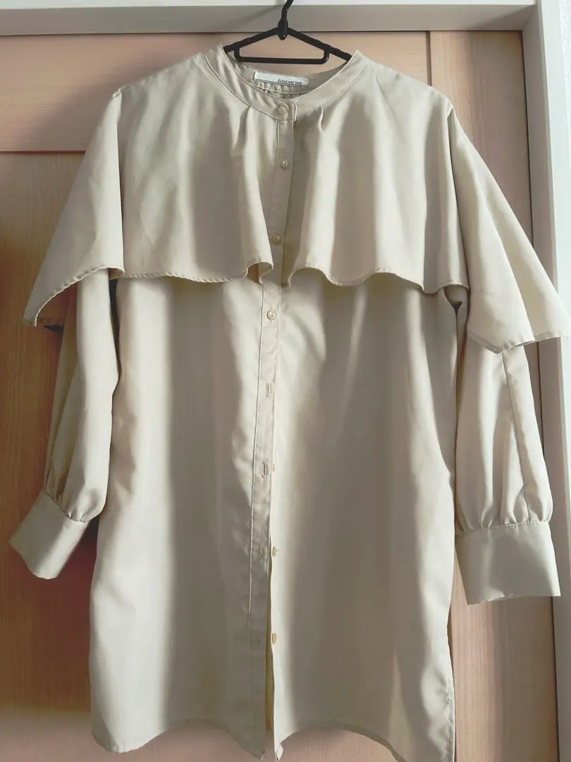 Thumbnail of Collarless ruffled shirt blouse