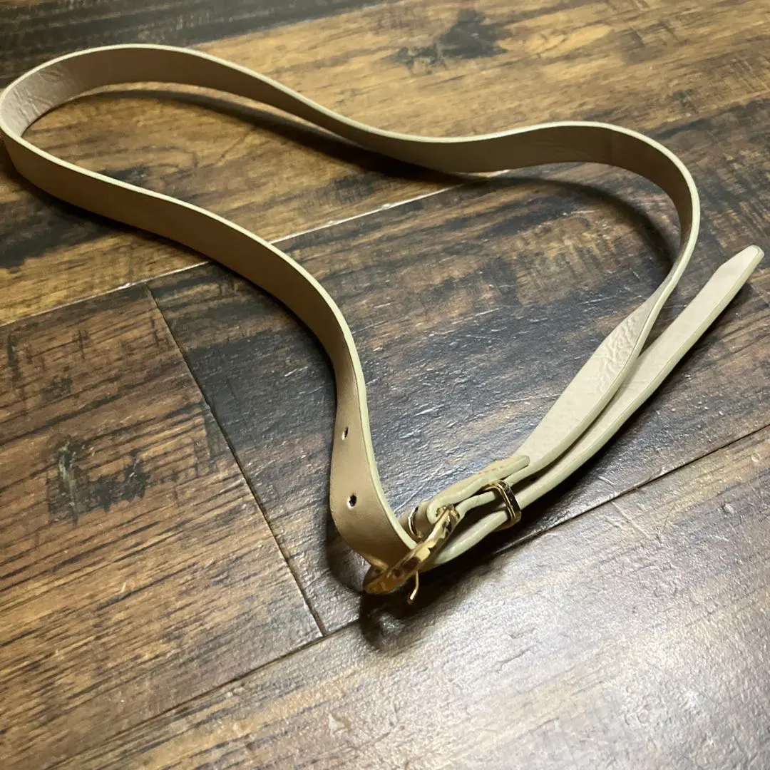 Thumbnail of Beige leather belt with gold buckle (five holes)