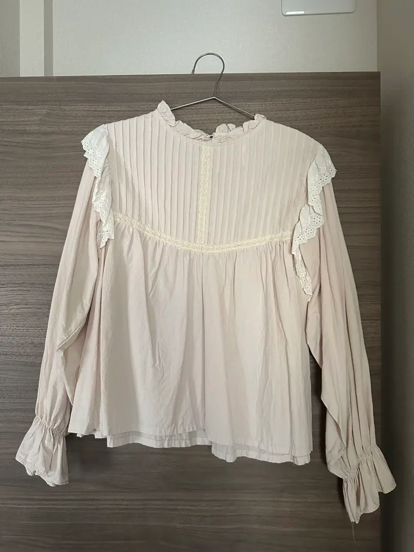 Thumbnail of Beige long-sleeved blouse with frills