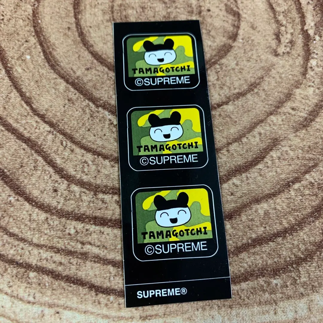 Supreme Tamagotchi カモフラージュ Supreme Tamagotchi (SS23) - $48