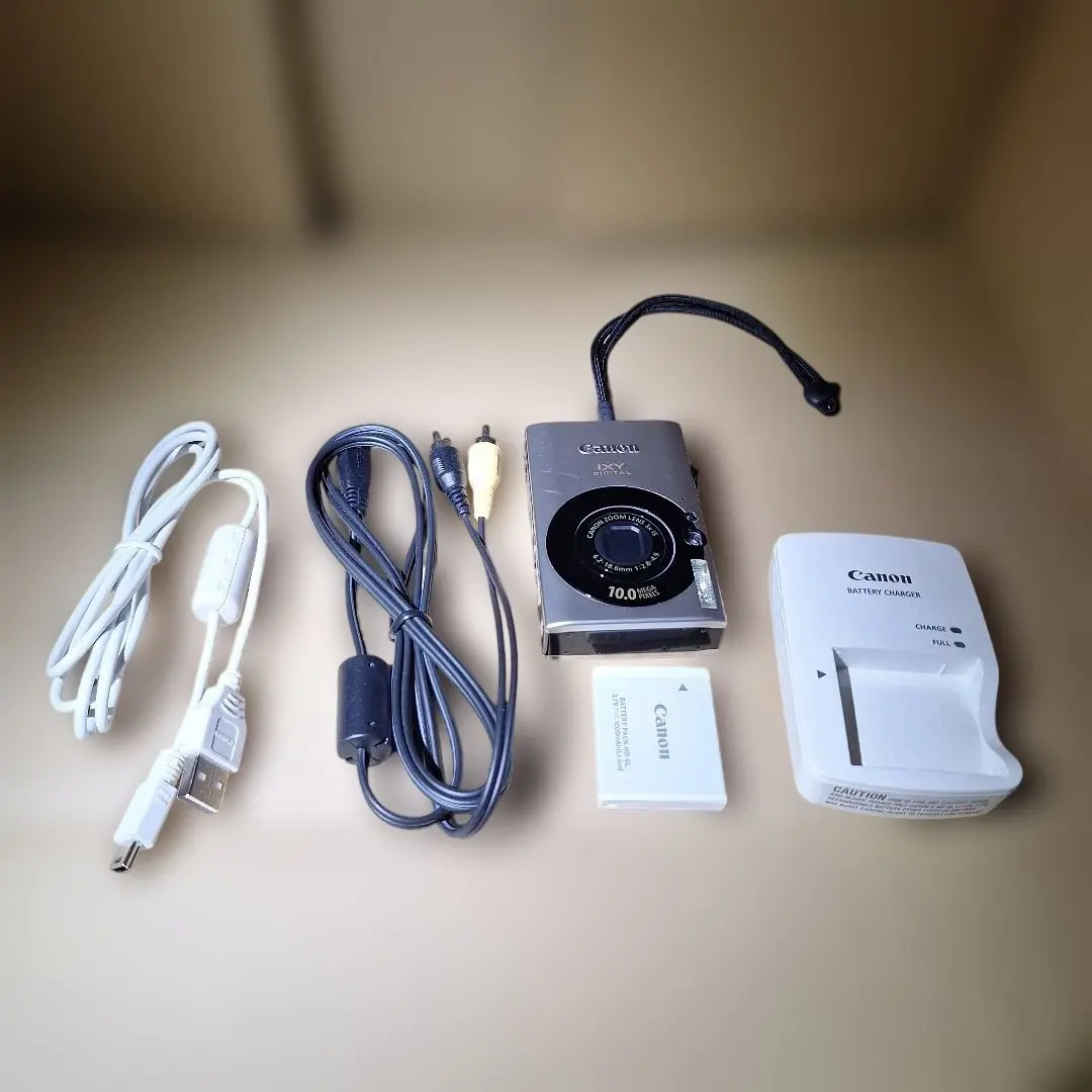 Thumbnail of Power on confirmed. Canon digital camera with accessories. [Junk item]