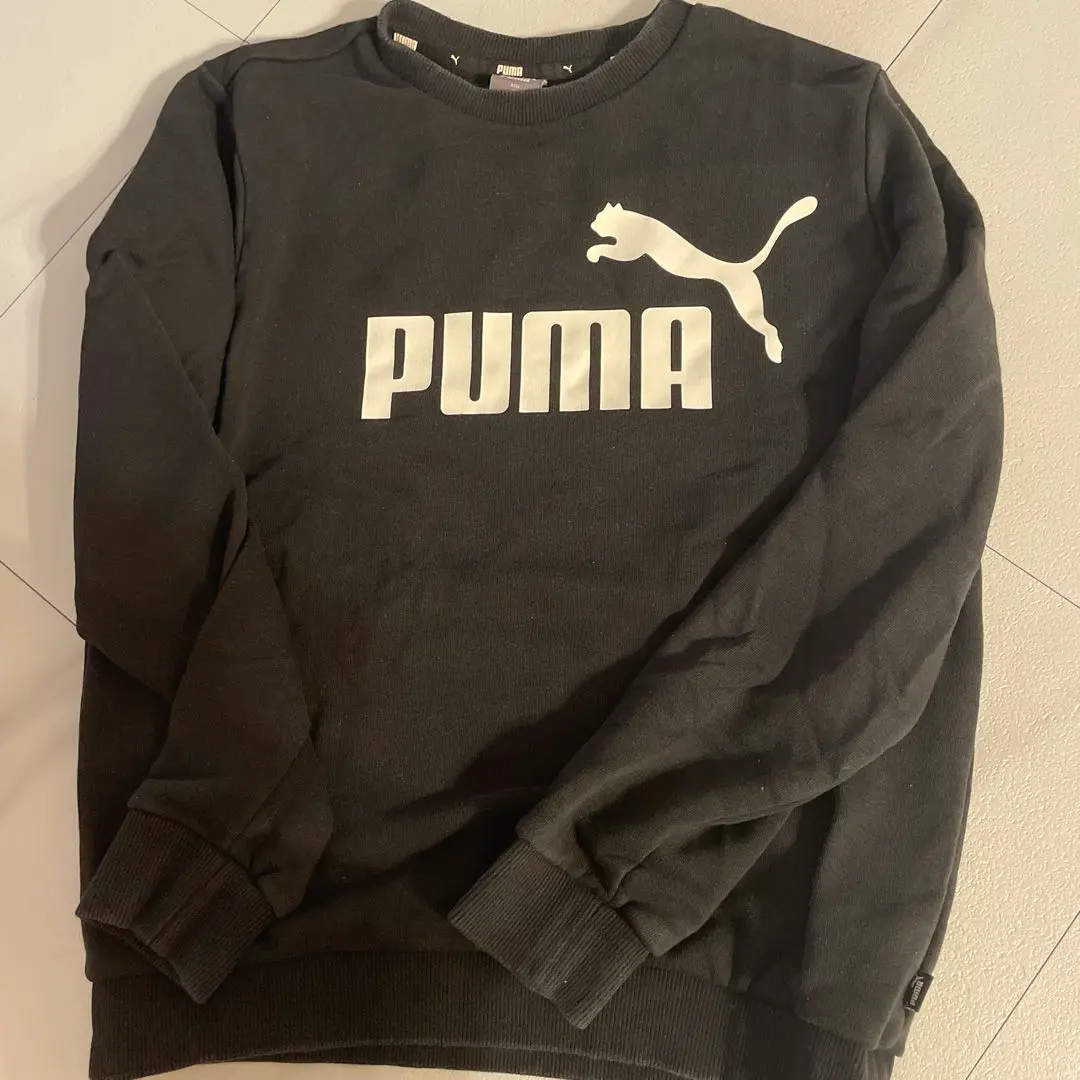 Thumbnail of PUMA black trainers