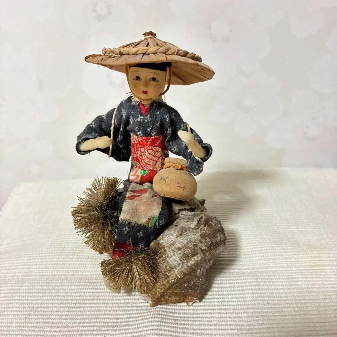 Thumbnail of A retro Showa-era doll, Sazae, with a female diver sitting on it.