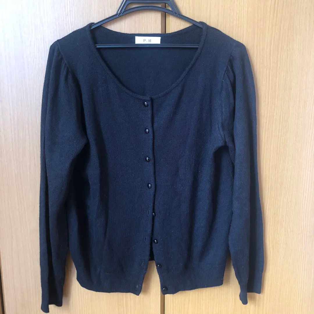 Thumbnail of Black long-sleeved cardigan ensemble