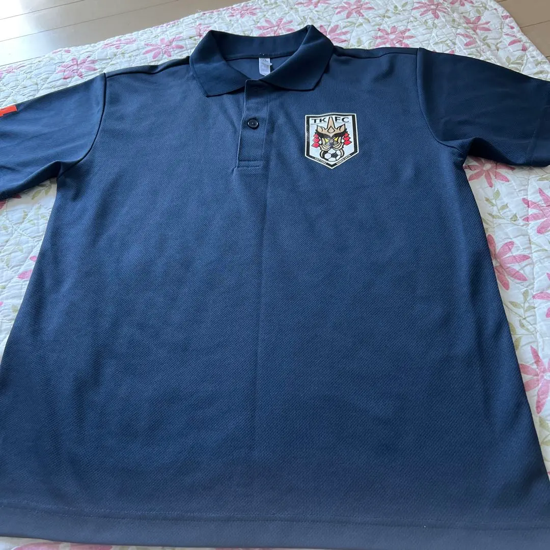 Thumbnail of Glimmer Navy Polo Shirt, M, with Soccer Team Emblem