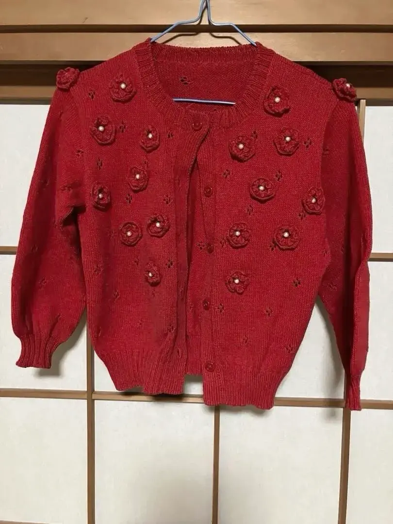 Thumbnail of Red flower motif knit cardigan, hand-knitted, for children