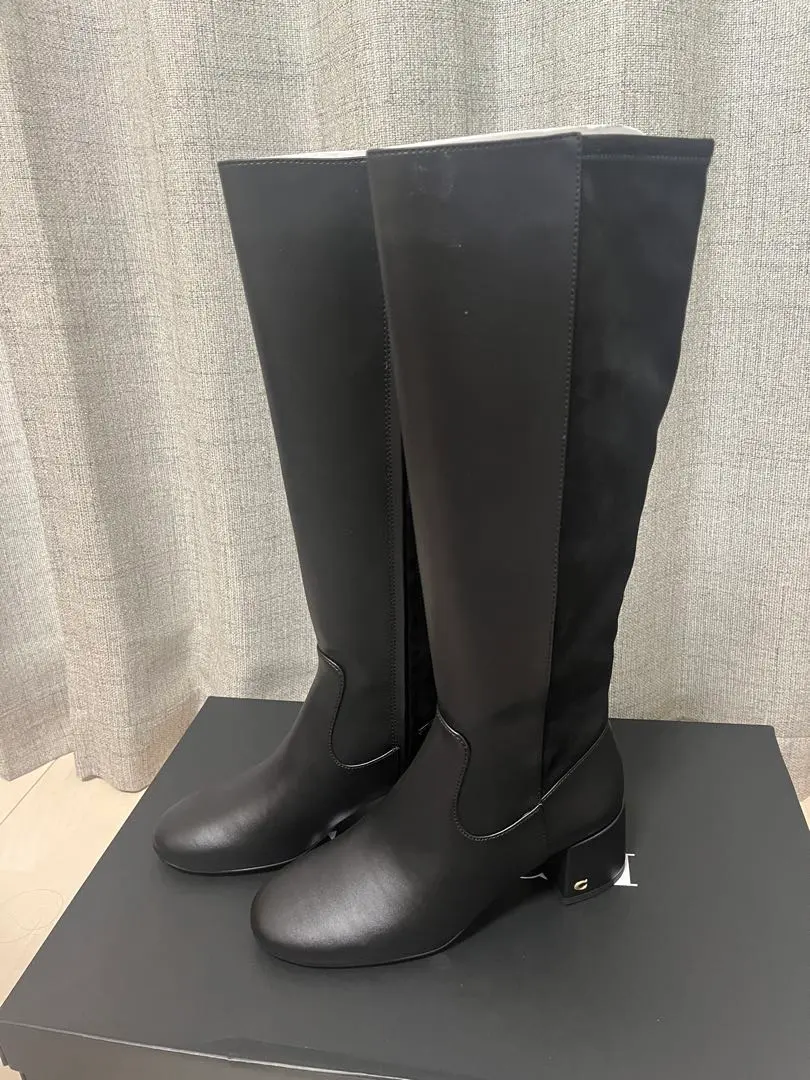 Thumbnail of Black long boots with gold logo
