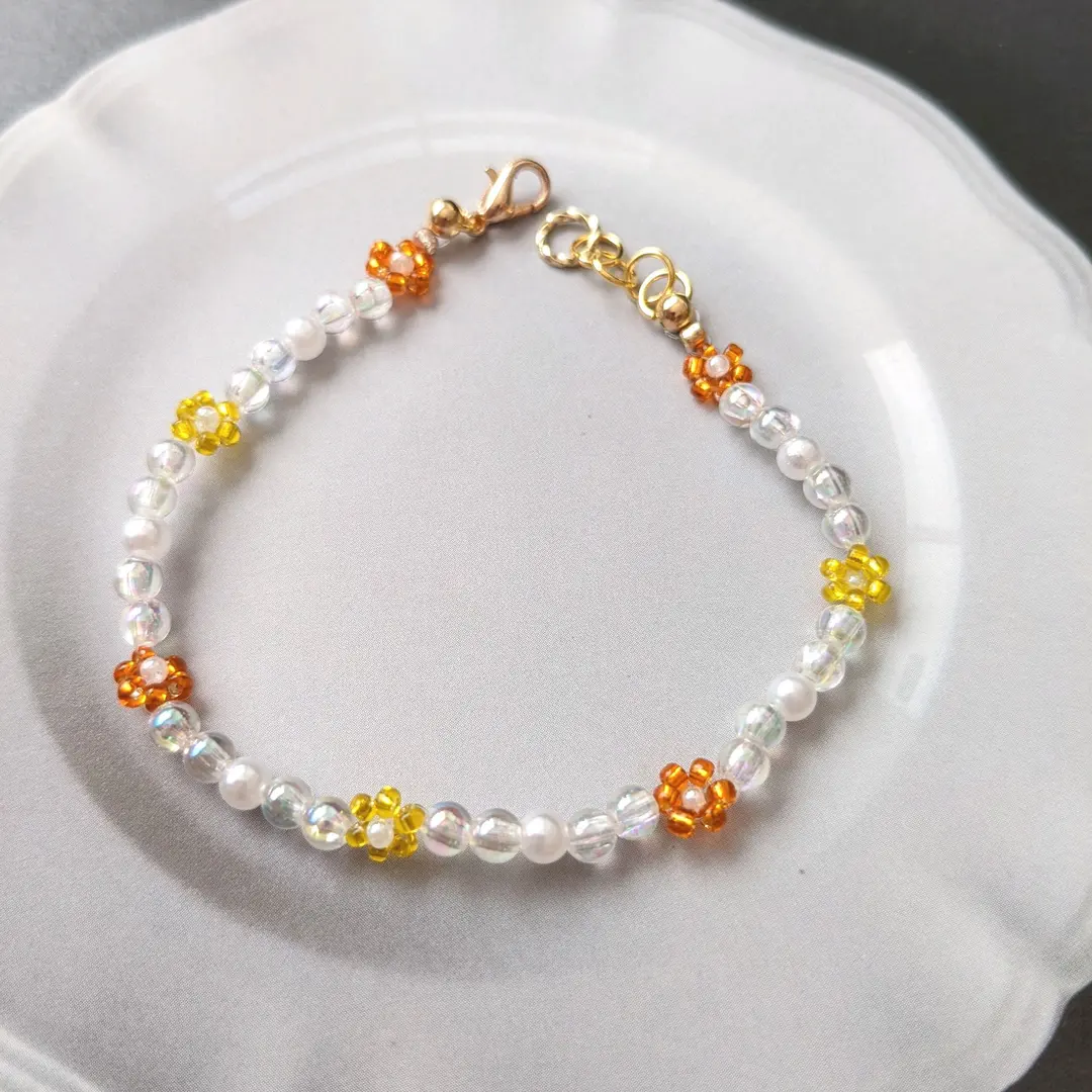 Thumbnail of B128 Orange & Yellow Flower Bead Bracelet