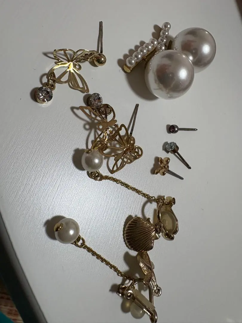 Thumbnail of 9 pairs of earrings and/or ear cuffs