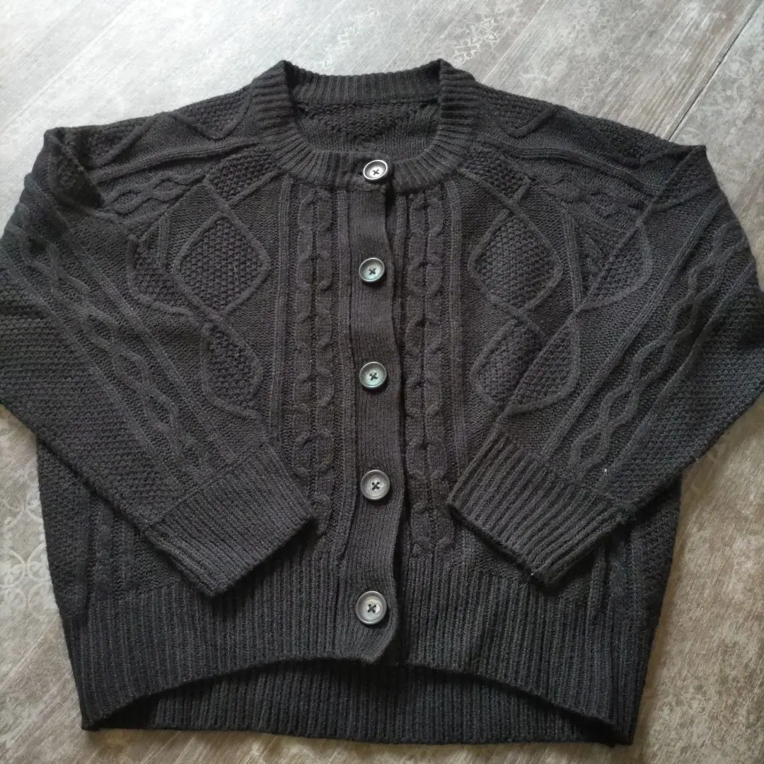 Thumbnail of Black cable knit cardigan, long sleeves. On sale now!