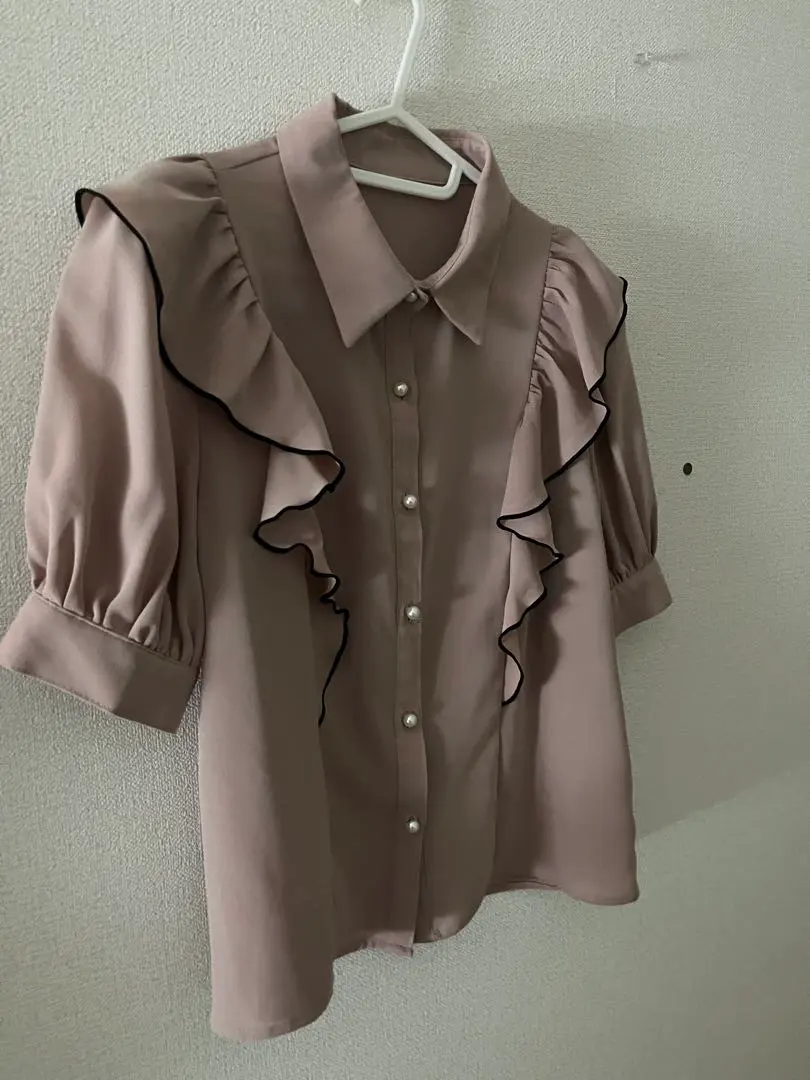 Thumbnail of Pink short-sleeved blouse with frills