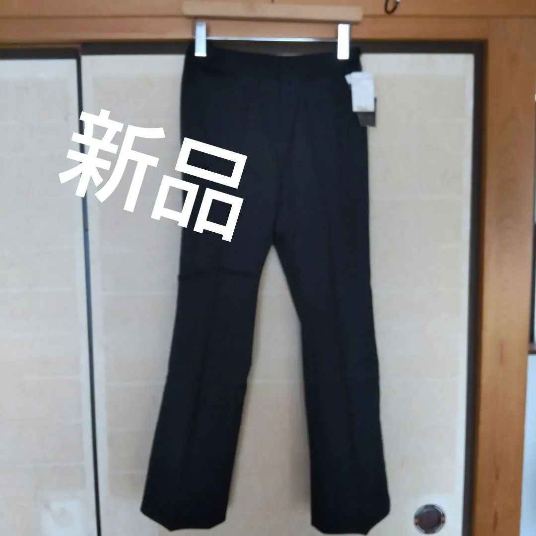 Thumbnail of New with tags, thin wool black pants, straight leg, unlined pants, M