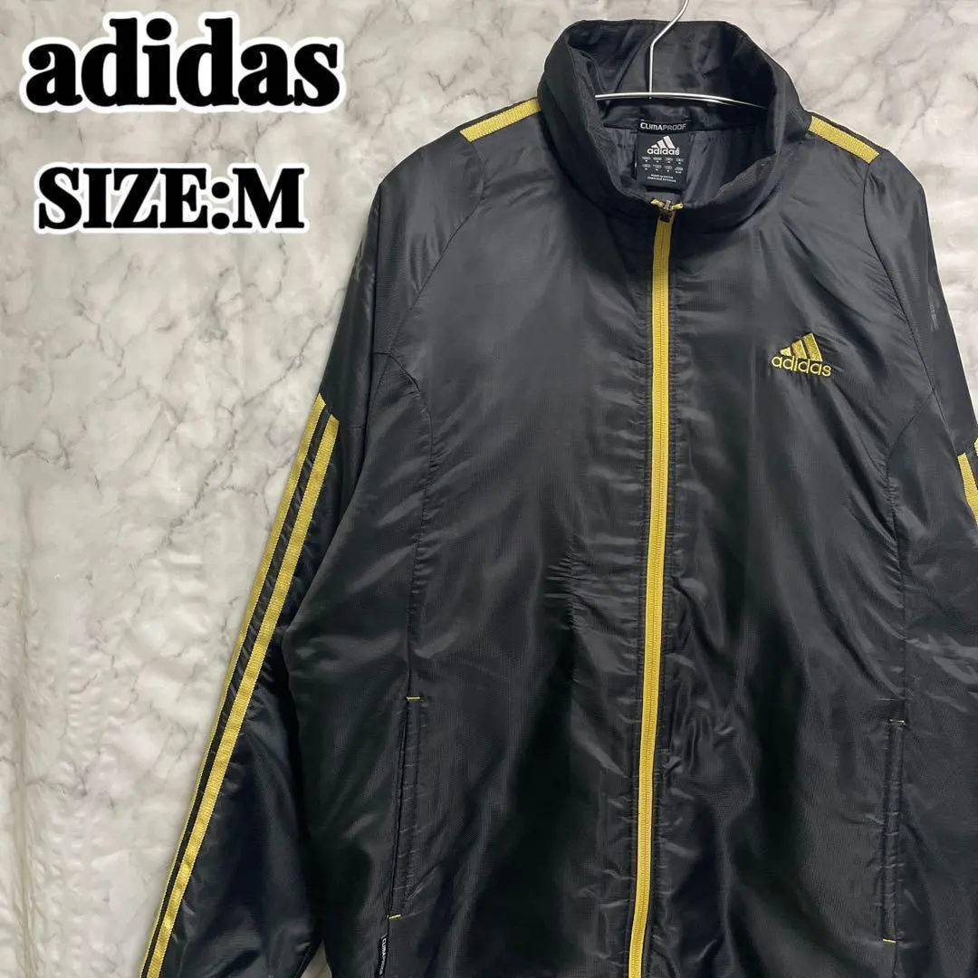 Thumbnail of Adidas nylon track jacket with gold stripes, one-point embroidery, size M