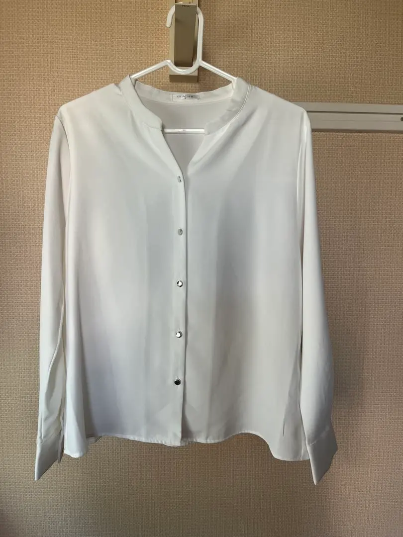 Thumbnail of White long-sleeved button-down shirt