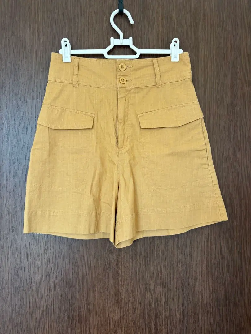Thumbnail of Mustard yellow high-waisted shorts