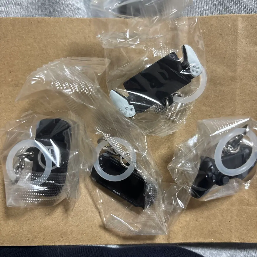 Thumbnail of Set of 4 PlayStation game controller keychains