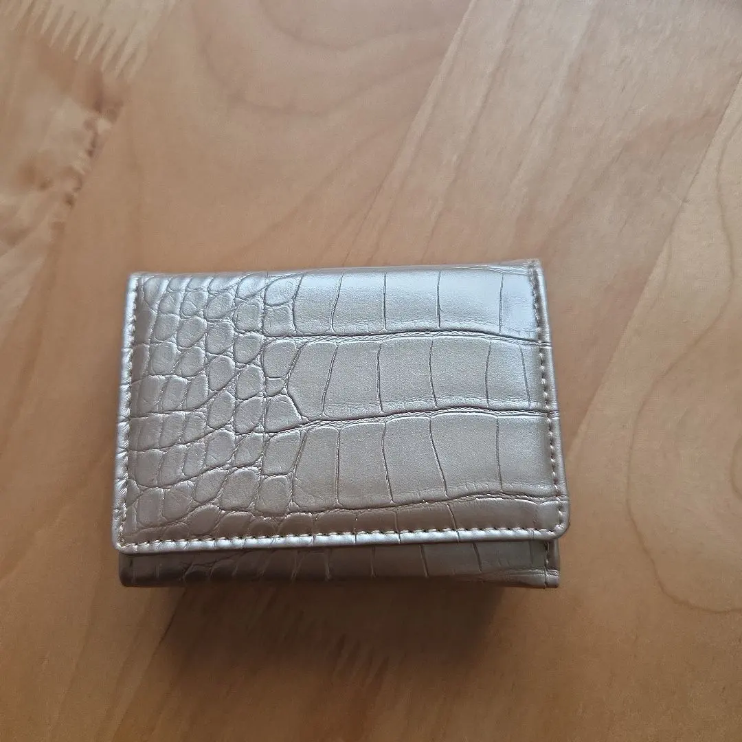 Thumbnail of Gold trifold wallet