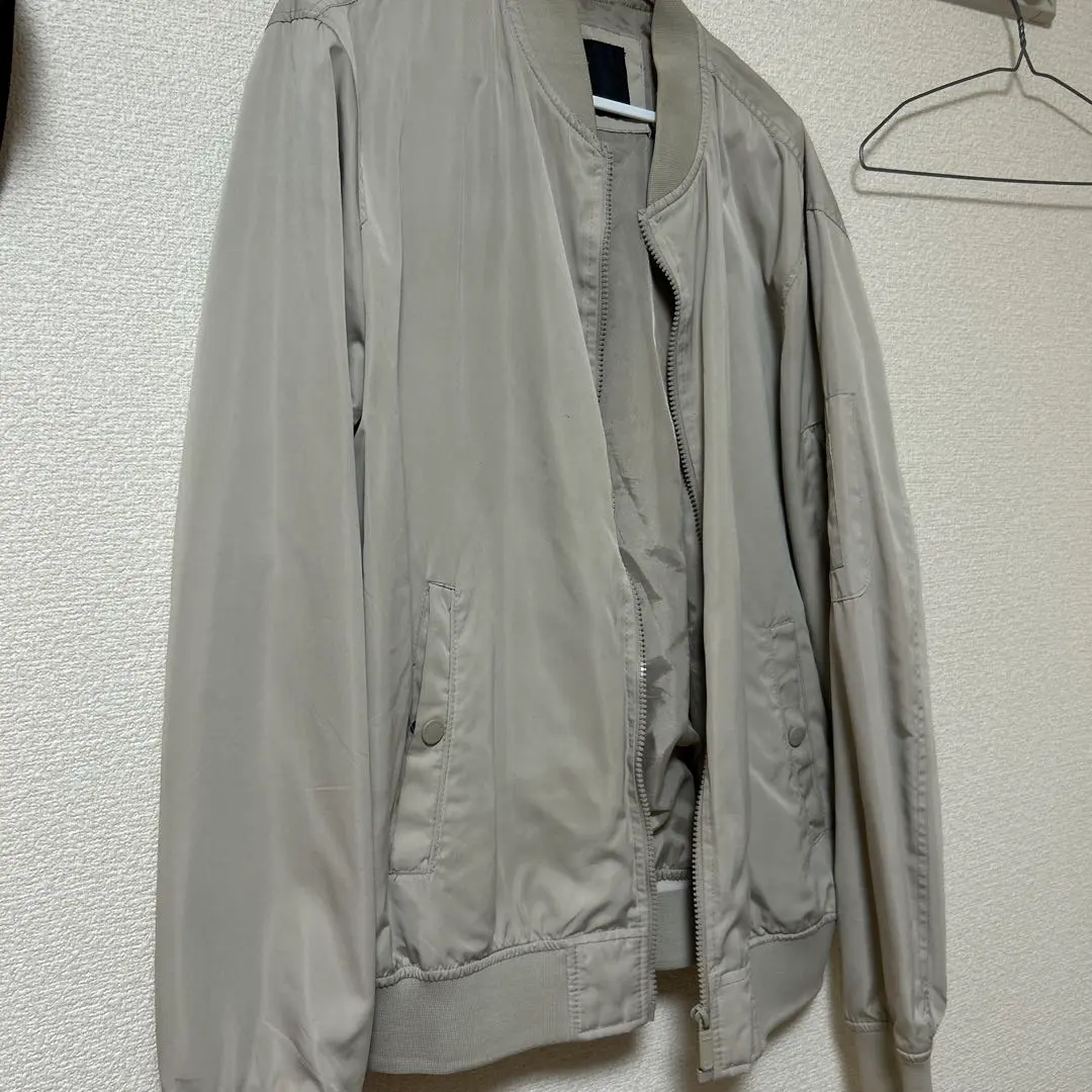 Thumbnail of Beige bomber jacket